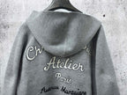 Gray hoodie with back print “Atelier Paris” and hood drape