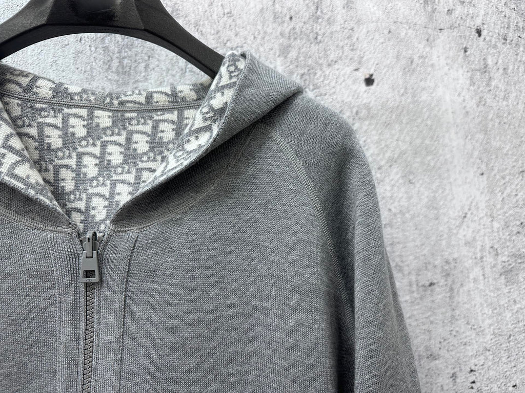 Gray hoodie with patterned hood lining and metal zipper hardware