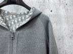 Gray hoodie with patterned hood lining and metal zipper hardware