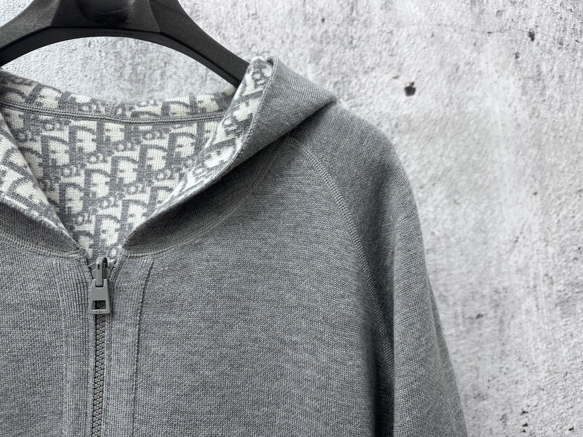 Gray hoodie with patterned hood lining and metal zipper hardware