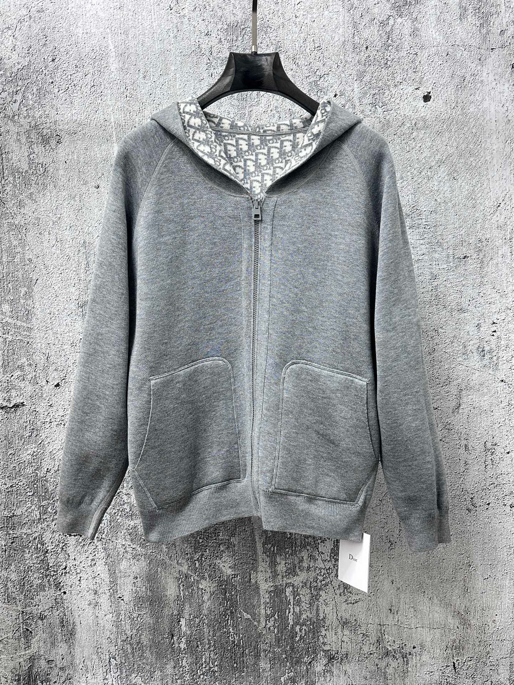 Gray zip-up hoodie with hood lining and front kangaroo pockets