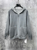 Gray zip-up hoodie with hood lining and front kangaroo pockets
