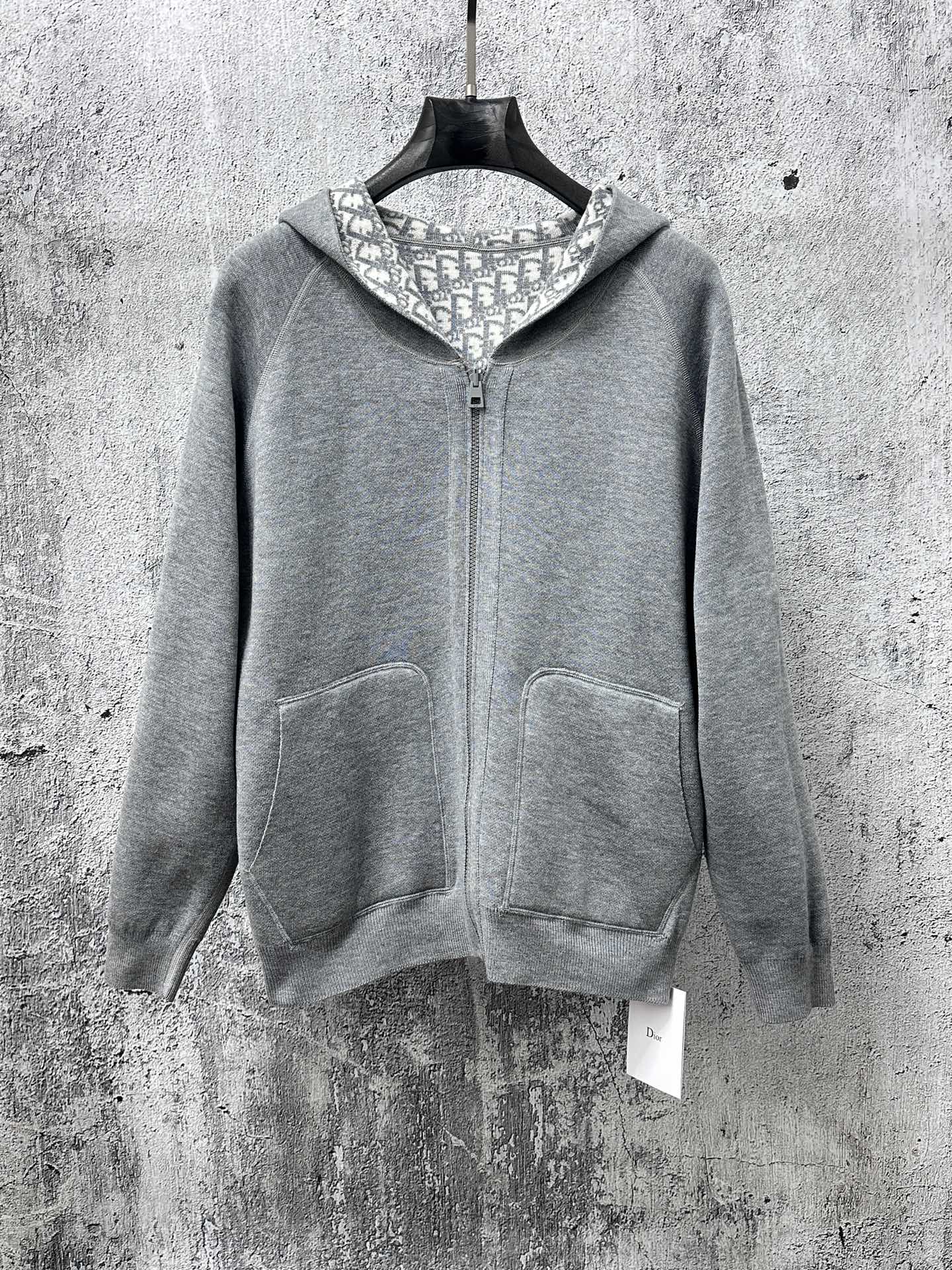 Gray zip-up hoodie with hood lining and front kangaroo pockets