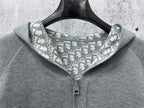Gray hoodie close-up of hood lining with Dior-style repeating pattern