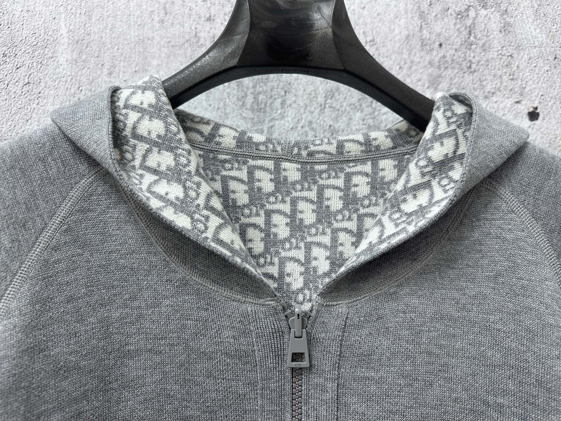 Gray hoodie close-up of hood lining with Dior-style repeating pattern