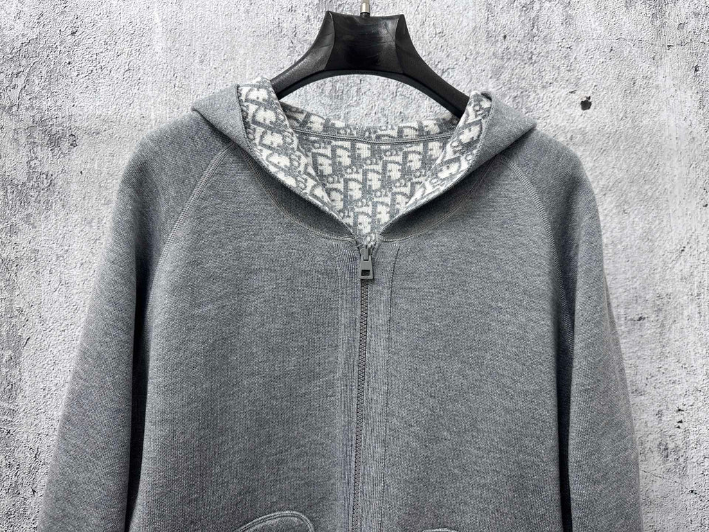 Gray zip-up hoodie with stand collar and front zipper closure
