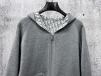 Gray zip-up hoodie with stand collar and front zipper closure