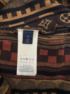 Inside neck label on patterned short-sleeve button-up shirt with size and care info