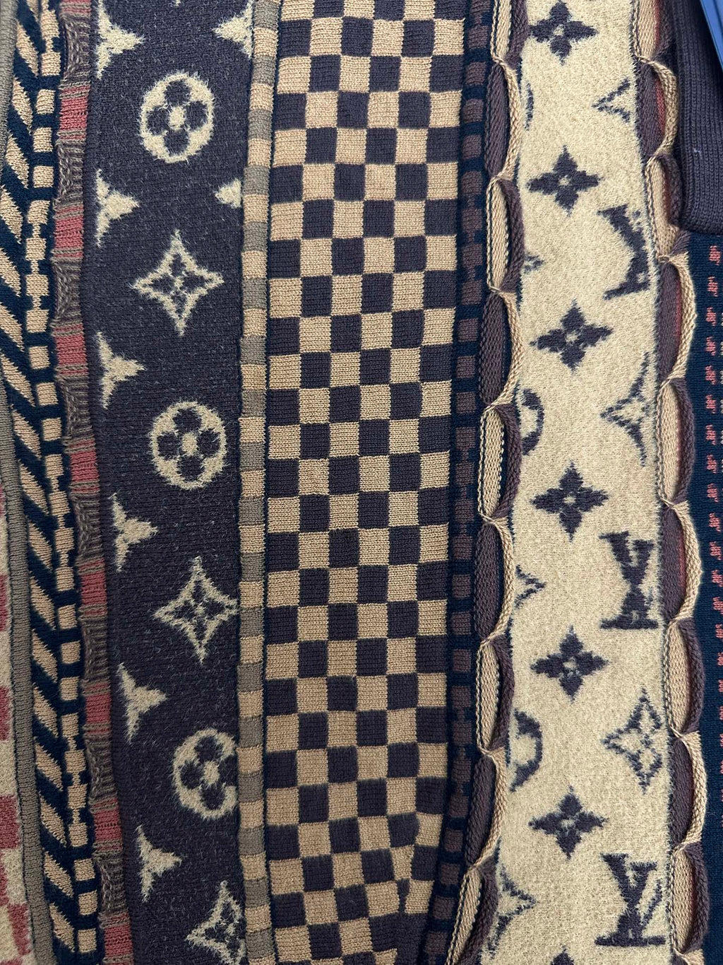 Front fabric close-up with monogram, checker, and star patterns beside button placket
