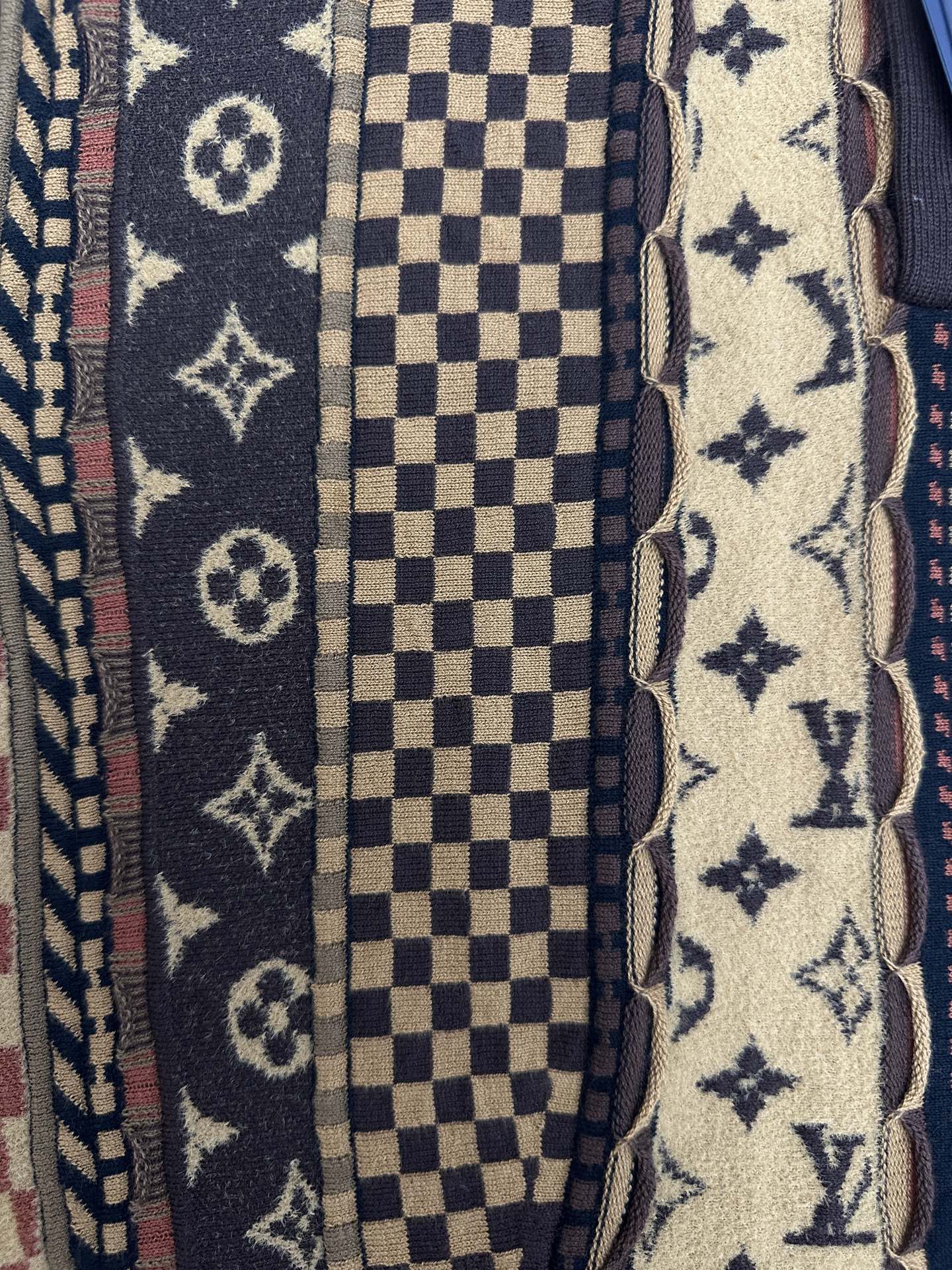 Front fabric close-up with monogram, checker, and star patterns beside button placket