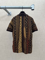 Back view of short-sleeve button-up shirt with monogram pattern and dark collar