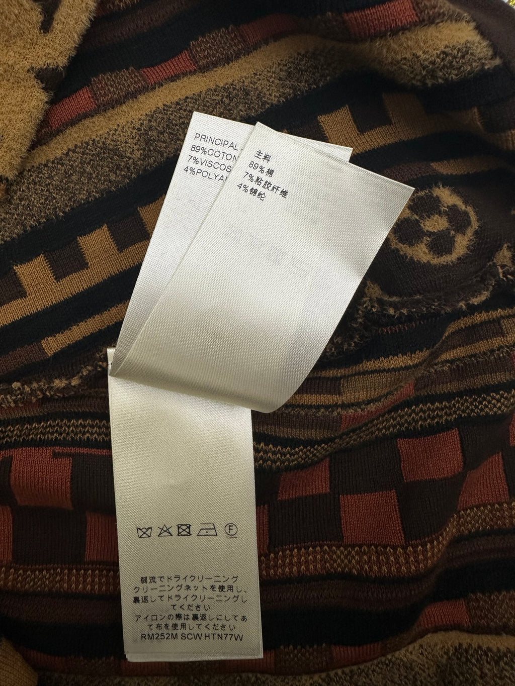 Paper care label on patterned short-sleeve button-up shirt with barcode and material text