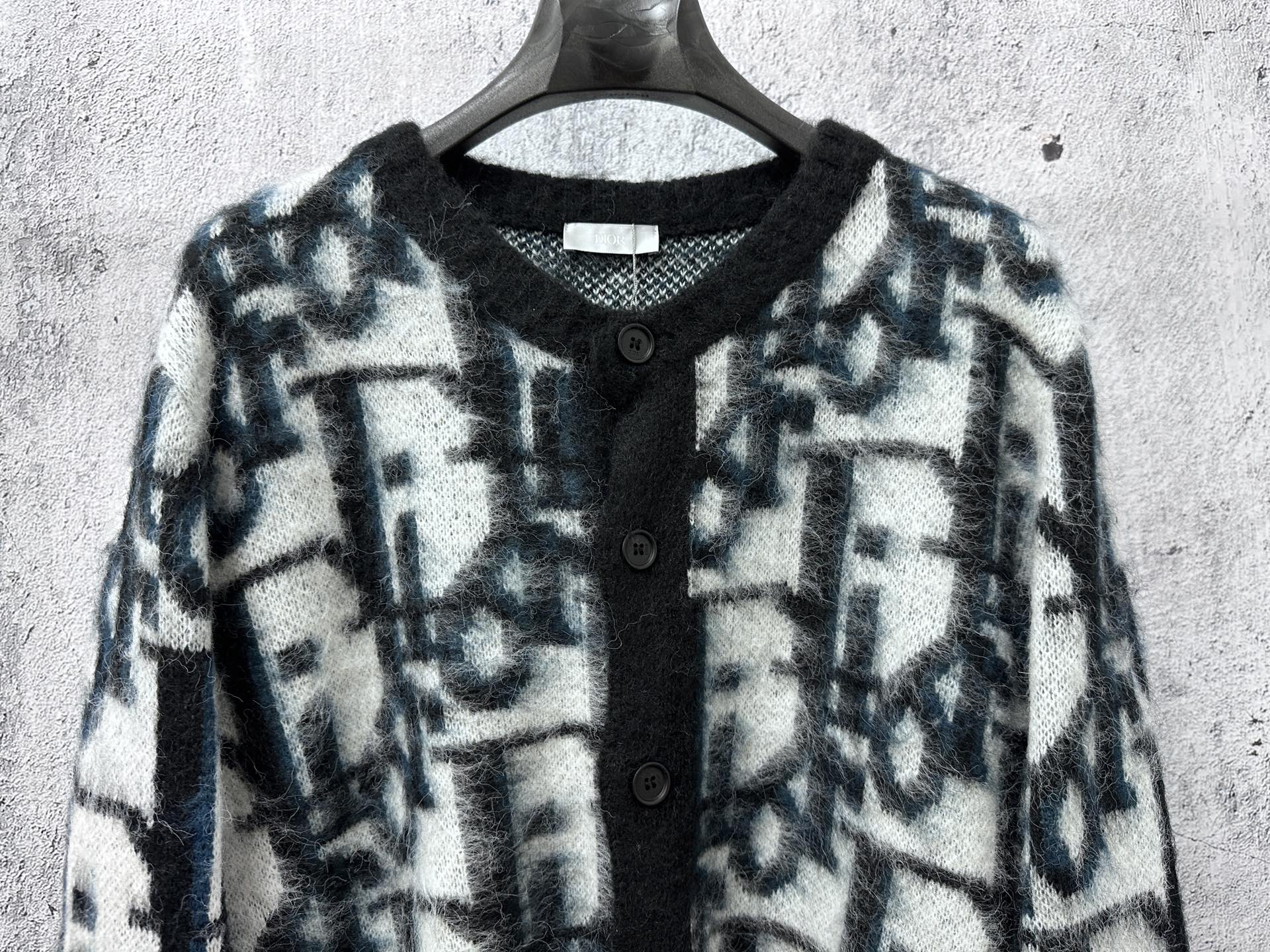 Dior long button-front sweater upper front view, blue and white abstract motif