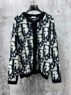 Dior long button-front sweater with blue and white abstract pattern, black collar