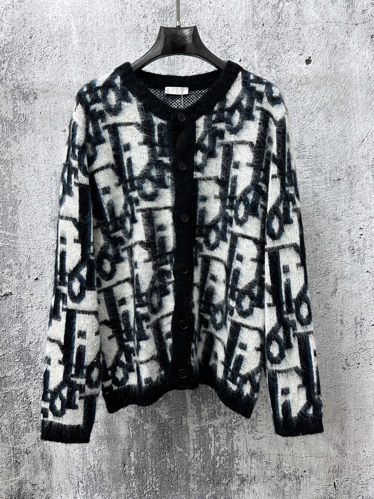 Dior long button-front sweater with blue and white abstract pattern, black collar