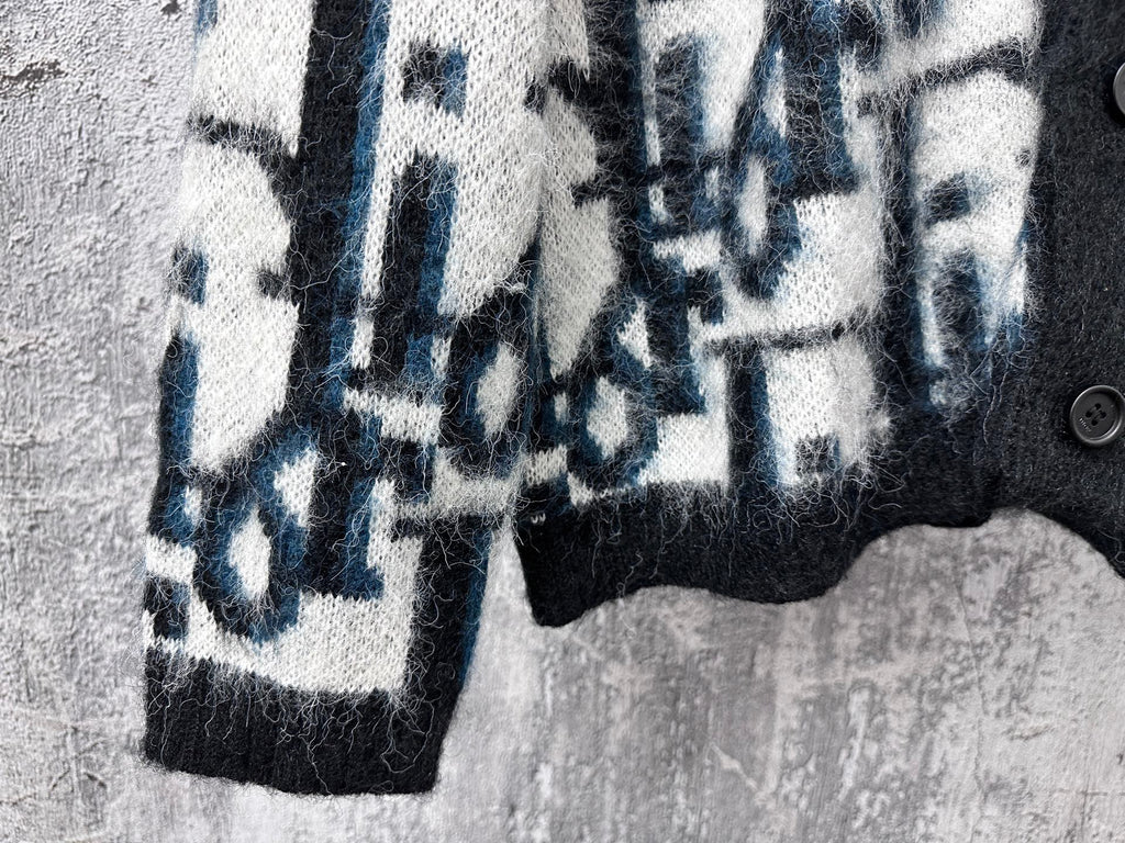 Dior long sweater sleeve with blue and white abstract blocks on dark knit