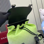 Gucci backpack interior opening with lime lining and drawstring cord at top
