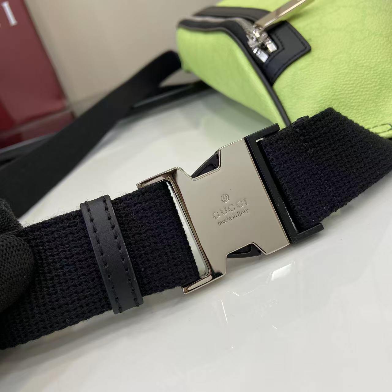Gucci belt bag strap with black webbing and metal buckle