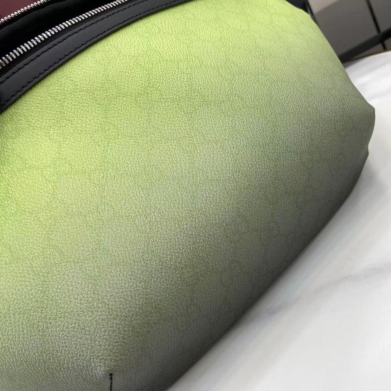 Gucci lime green pebbled leather belt bag panel close-up