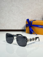 Louis Vuitton sunglasses, dark gray lenses, black frame, gold logo temple detail