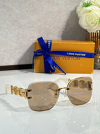 Louis Vuitton sunglasses, rose-tinted lenses, gold frame, gold logo temple detail