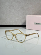 MiuMiu eyeglasses with gold square frames and clear lenses