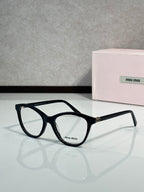 MiuMiu eyeglasses with black frames and metal logo on temple