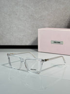 Clear rectangular eyeglasses with metal hinges and Miu Miu logo