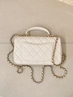 Chanel quilted mini flap bag, white with gold chain strap and front flap stitching