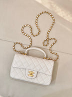 Chanel quilted mini flap bag, white with gold chain shoulder strap and CC logo