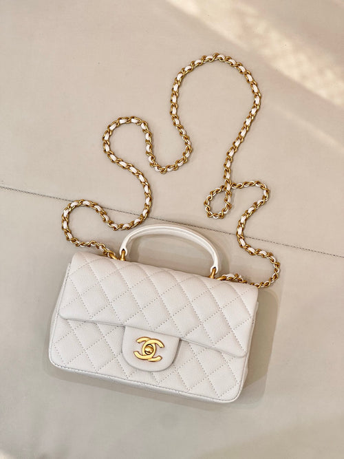 Chanel quilted mini flap bag, white with gold chain shoulder strap and CC logo