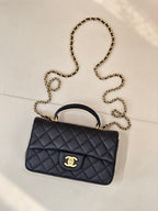 Chanel dark navy quilted mini flap bag with gold chain crossbody strap and logo clasp