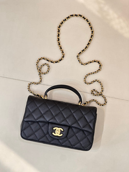 Chanel dark navy quilted mini flap bag with gold chain crossbody strap and logo clasp