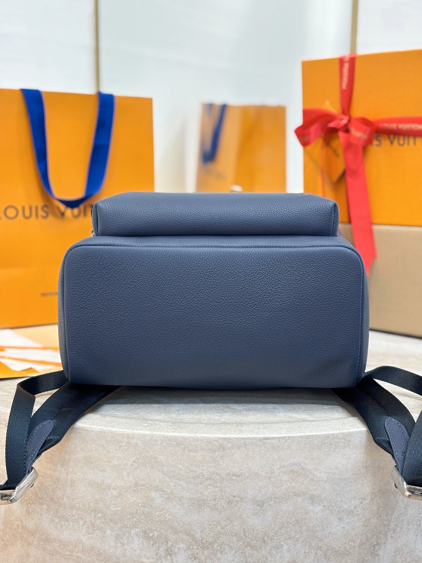 Louis Vuitton blue leather backpack front view with twin straps