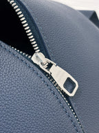 Louis Vuitton blue leather zipper pull detail with silver hardware