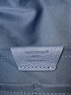Louis Vuitton blue leather logo patch on backpack flap