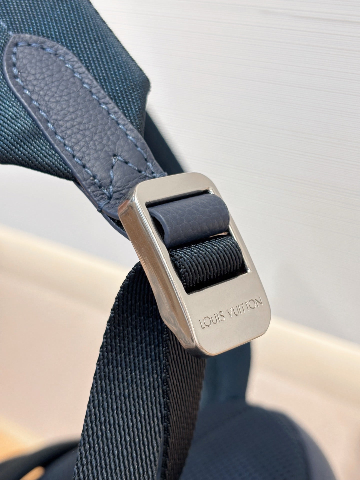 Louis Vuitton blue adjustable strap with metal buckle detail