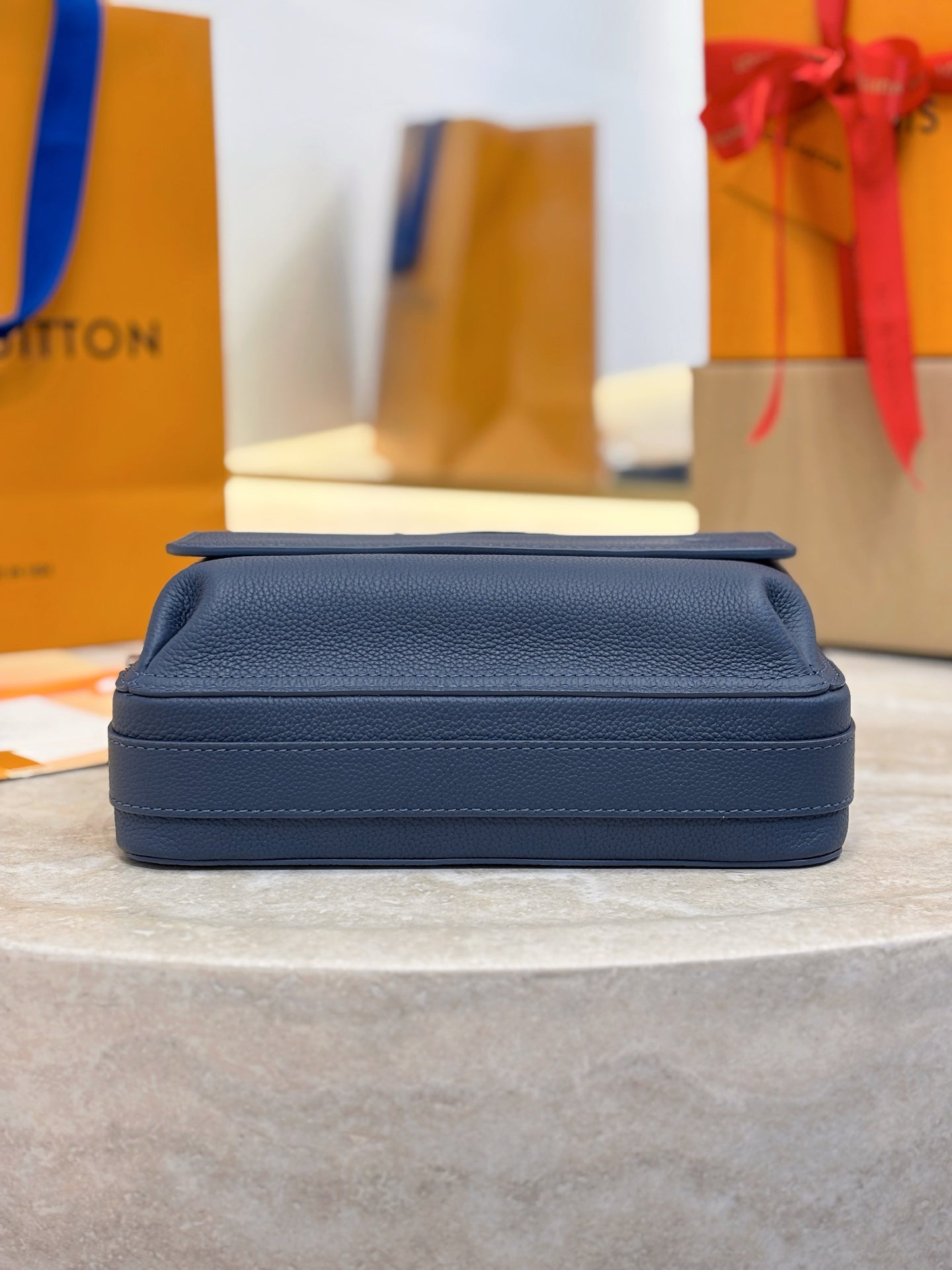 Louis Vuitton blue leather crossbody bag back view with top flap and stitched trim