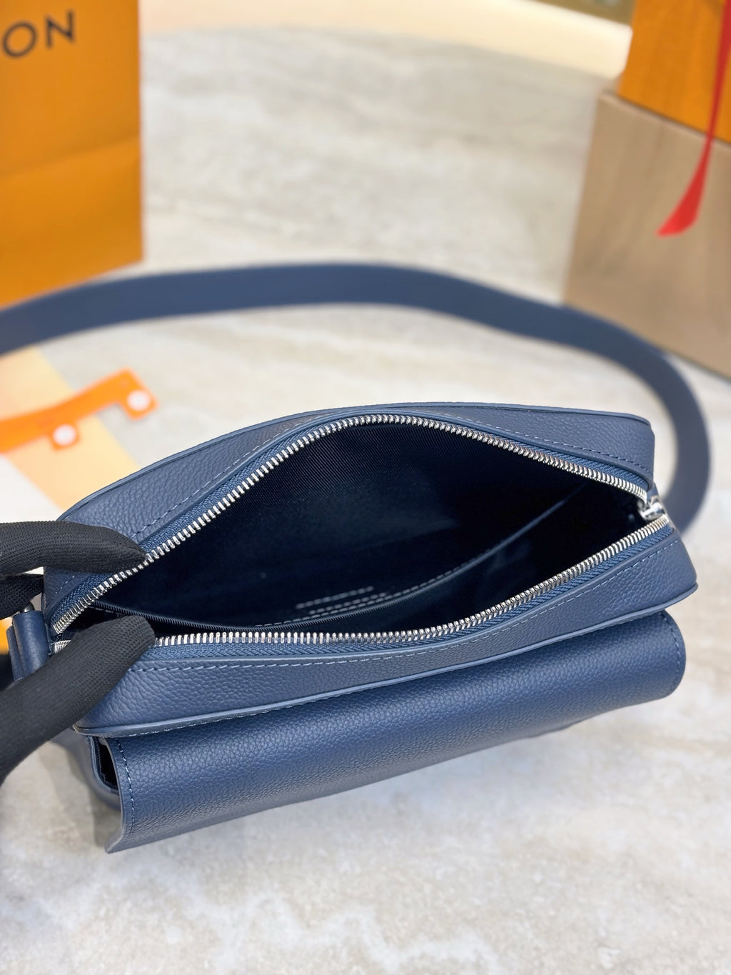 Louis Vuitton blue leather crossbody bag open top with zippered interior