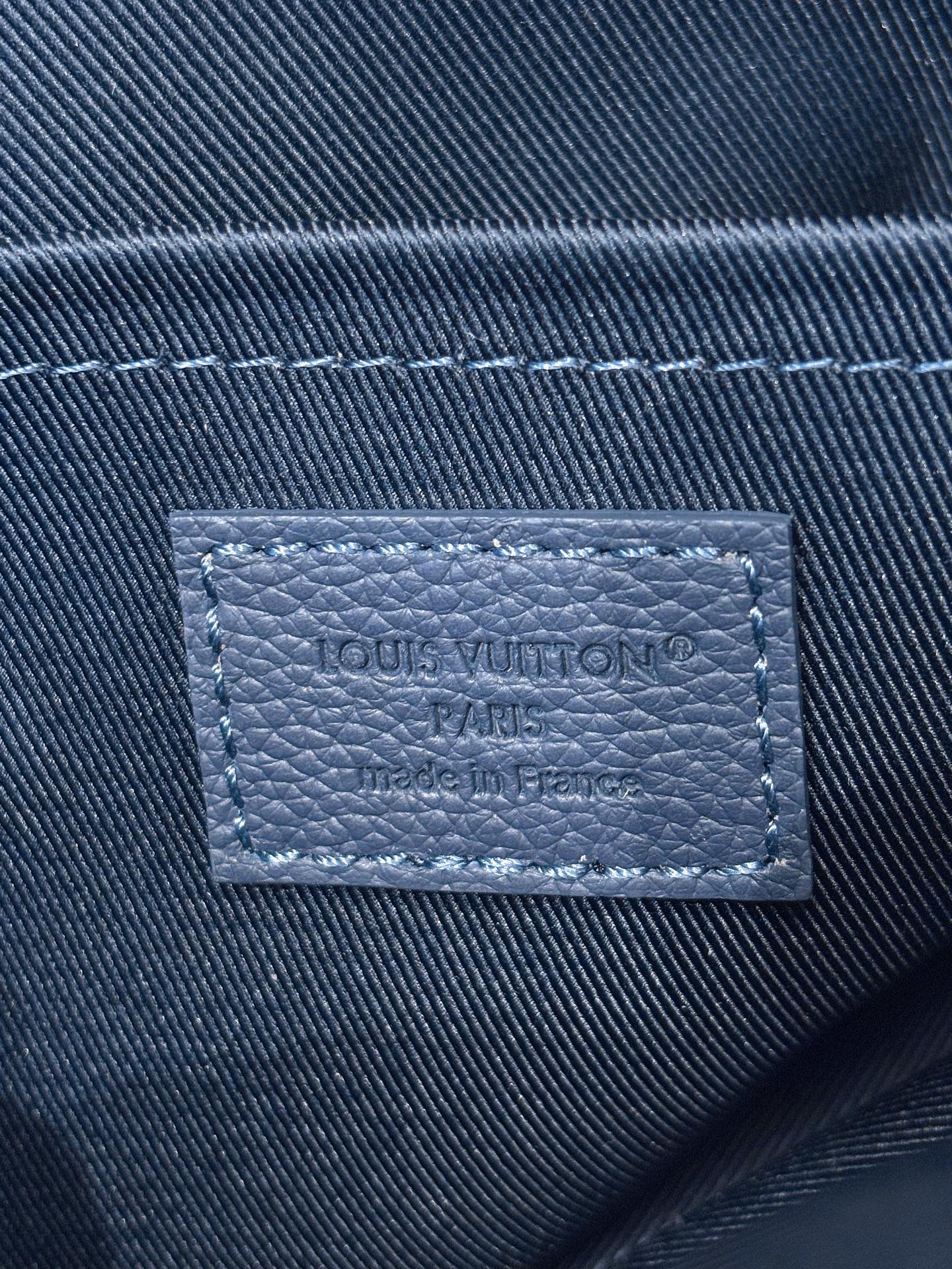 Louis Vuitton Paris made in France interior label on blue leather bag