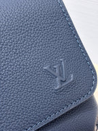 Louis Vuitton blue leather bag corner with embossed LV logo and stitched edge