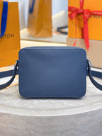 Louis Vuitton blue leather crossbody bag front view with adjustable shoulder strap