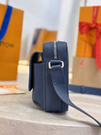 Louis Vuitton blue leather crossbody bag side view with zipper and strap loop