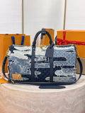 Louis Vuitton patchwork denim handbag with navy and light-blue panels, front straps