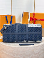 Louis Vuitton patchwork denim handbag side view with navy flap and structured base