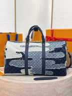 Louis Vuitton patchwork denim handbag with top handles and front zipper panel, navy blue