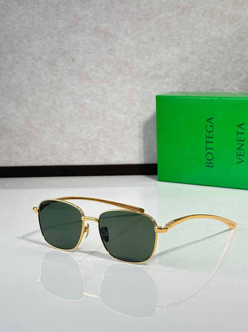Gold-frame sunglasses with dark green round lenses