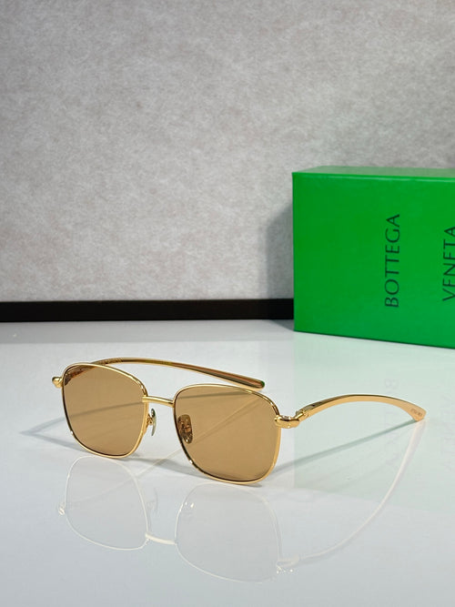 Gold-frame sunglasses with amber round lenses