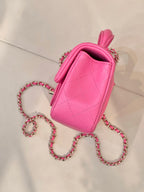 Chanel pink quilted mini bag with back view and chain crossbody strap