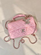 Chanel quilted pink crossbody bag with rhinestone bow detail and CC logo